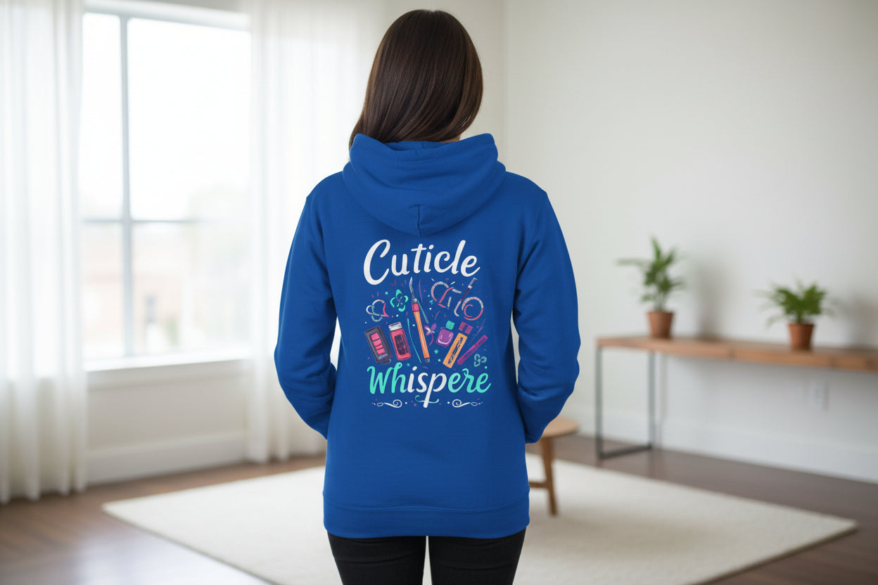 Blue hoodie with 'Cuticle Whispere' text and nail polish graphic on a white background