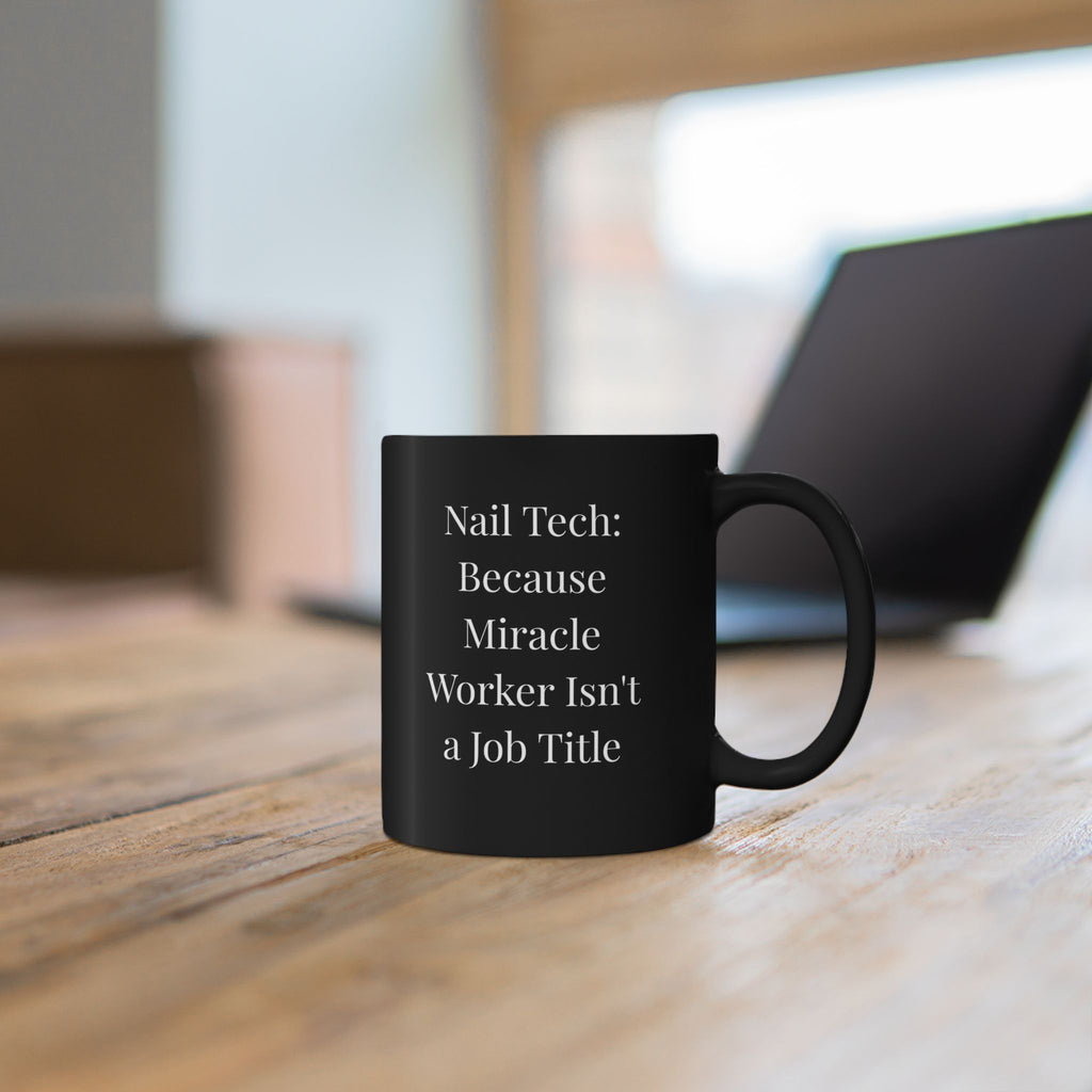 Black mug with white map design on a wooden surface