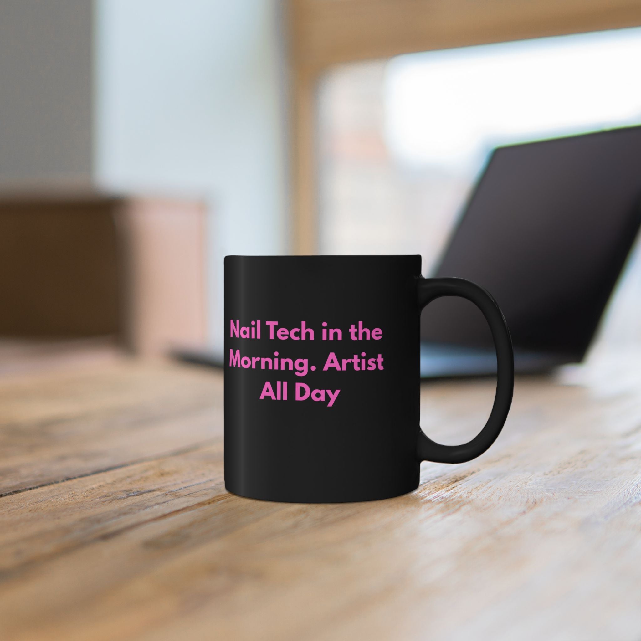 Black mug with white map design on a wooden surface