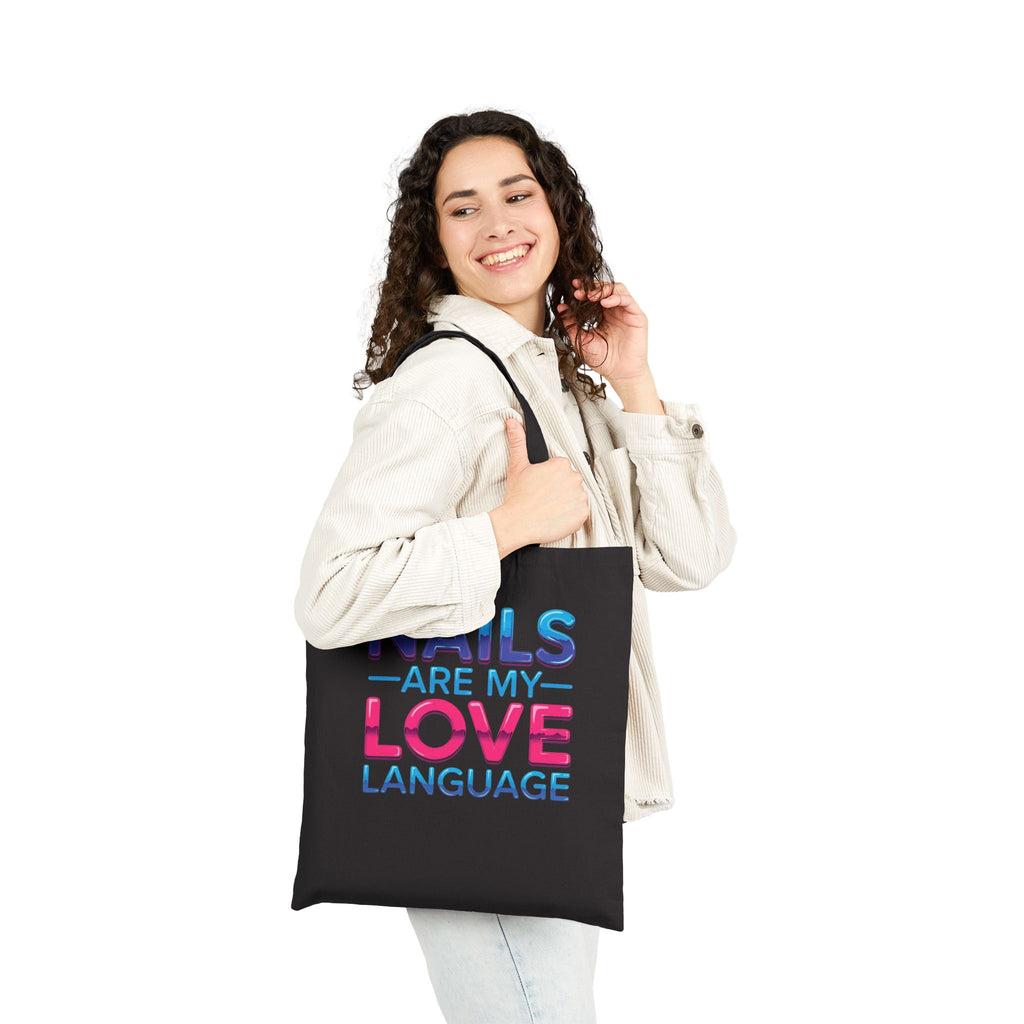 Woman holding a black tote bag with text on a white background