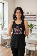 Black tank top with colorful text 'I do nails not miracles' on a white background