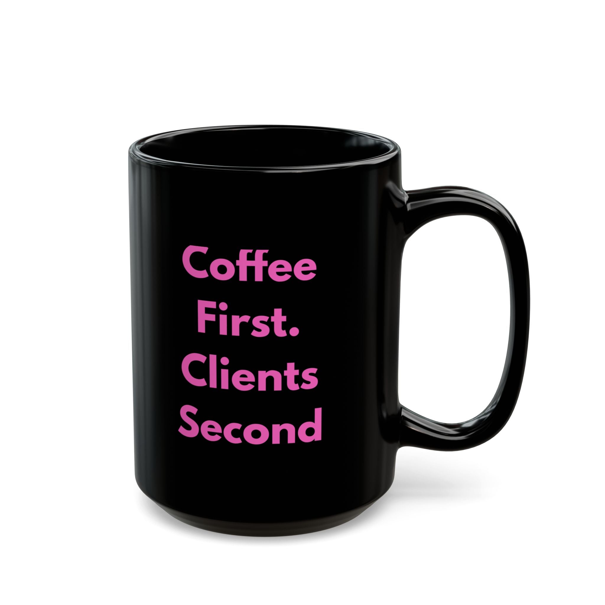 Black mug with pink text 'Coffee First. Clients Second' on a white background