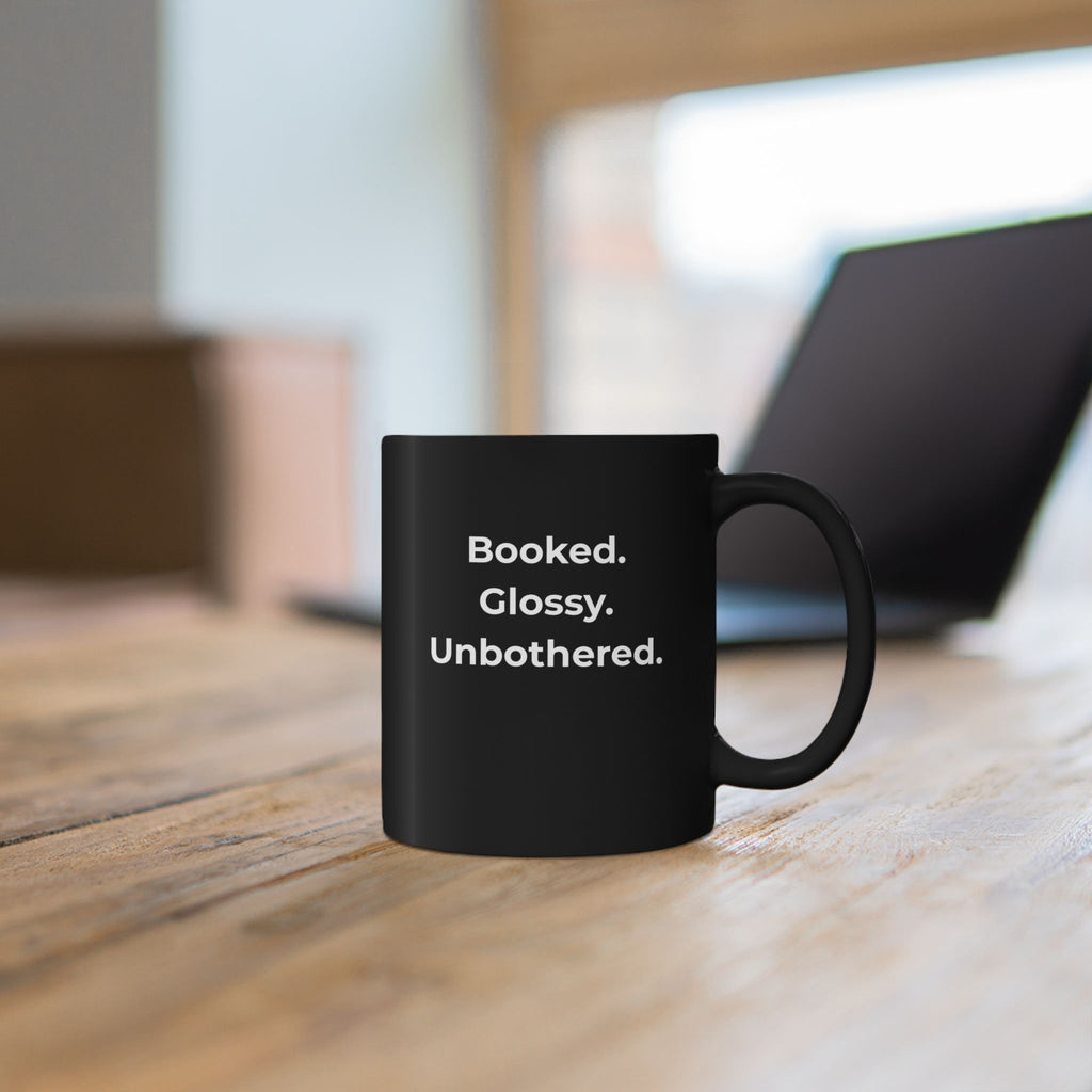 Black mug with 'High Lady of the Night Court' design on a wooden surface.