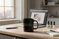 Black mug with white text on a white background