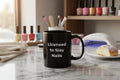 Black mug with a graphic of a person with dreadlocks and text 'Good morning, Jah' on a white background