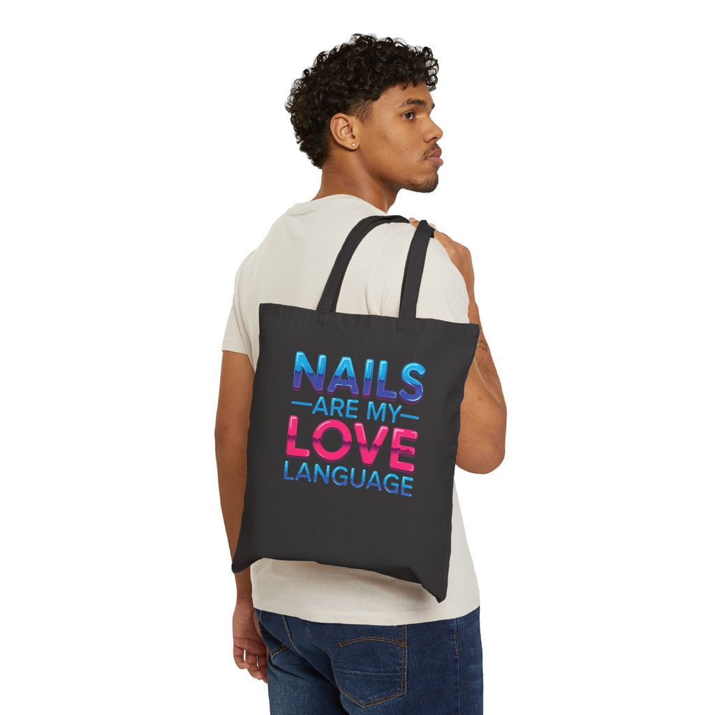 Man carrying a black tote bag with a design on a white background