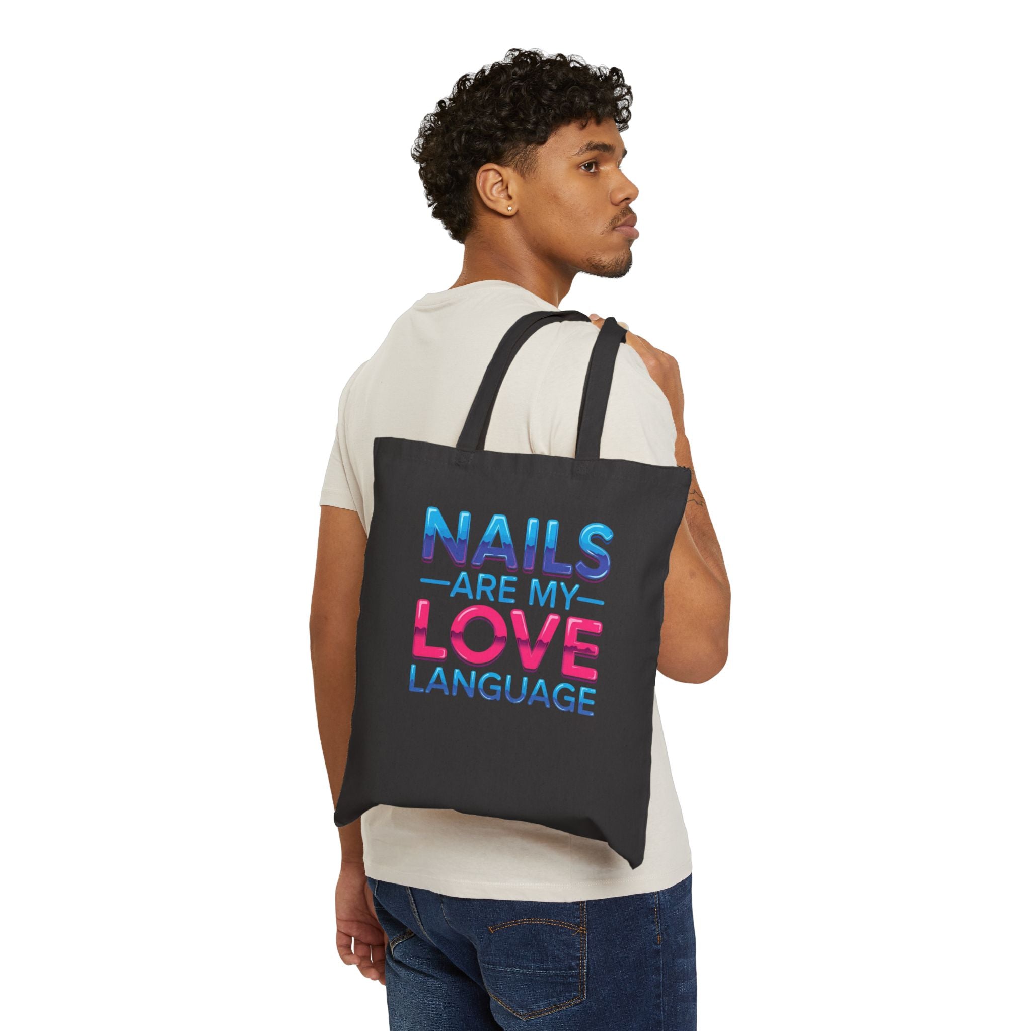 Man carrying a black tote bag with a design on a white background