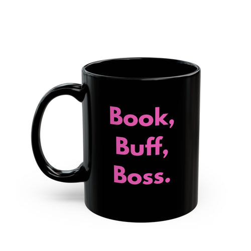 Black mug with pink text 'Book, Buff, Boss' on a white background