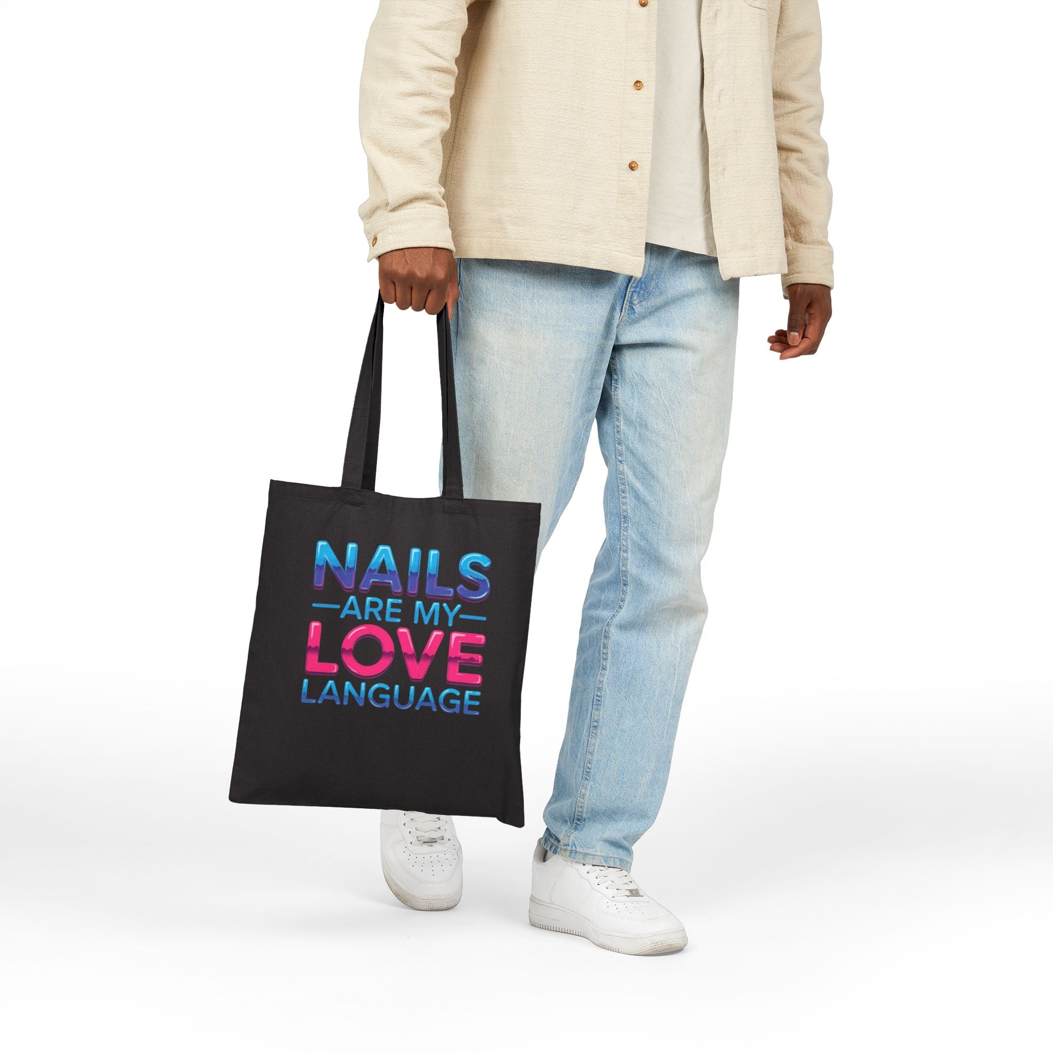Person holding a black tote bag with 'Beach days are my favorite days' text on a white background