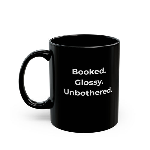 Black mug with white text on a white background