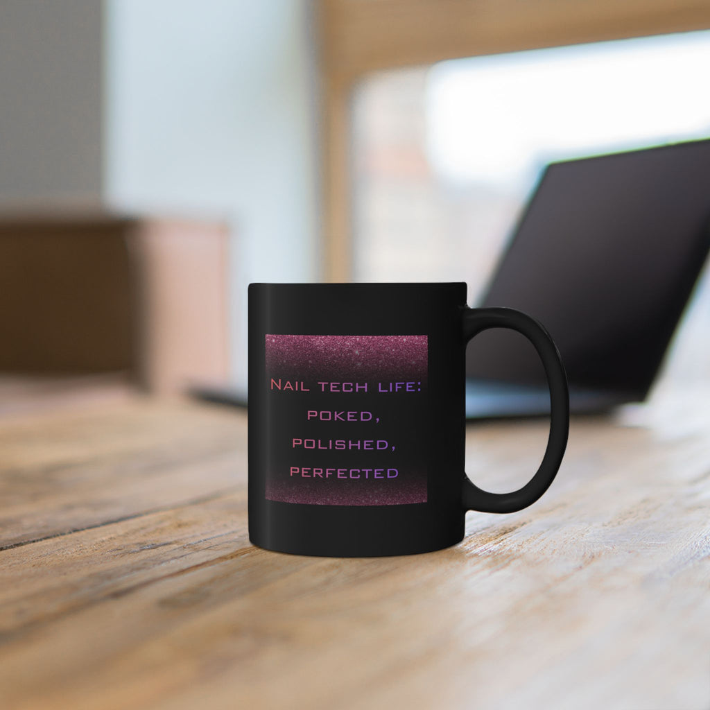 Black mug with text on a wooden surface