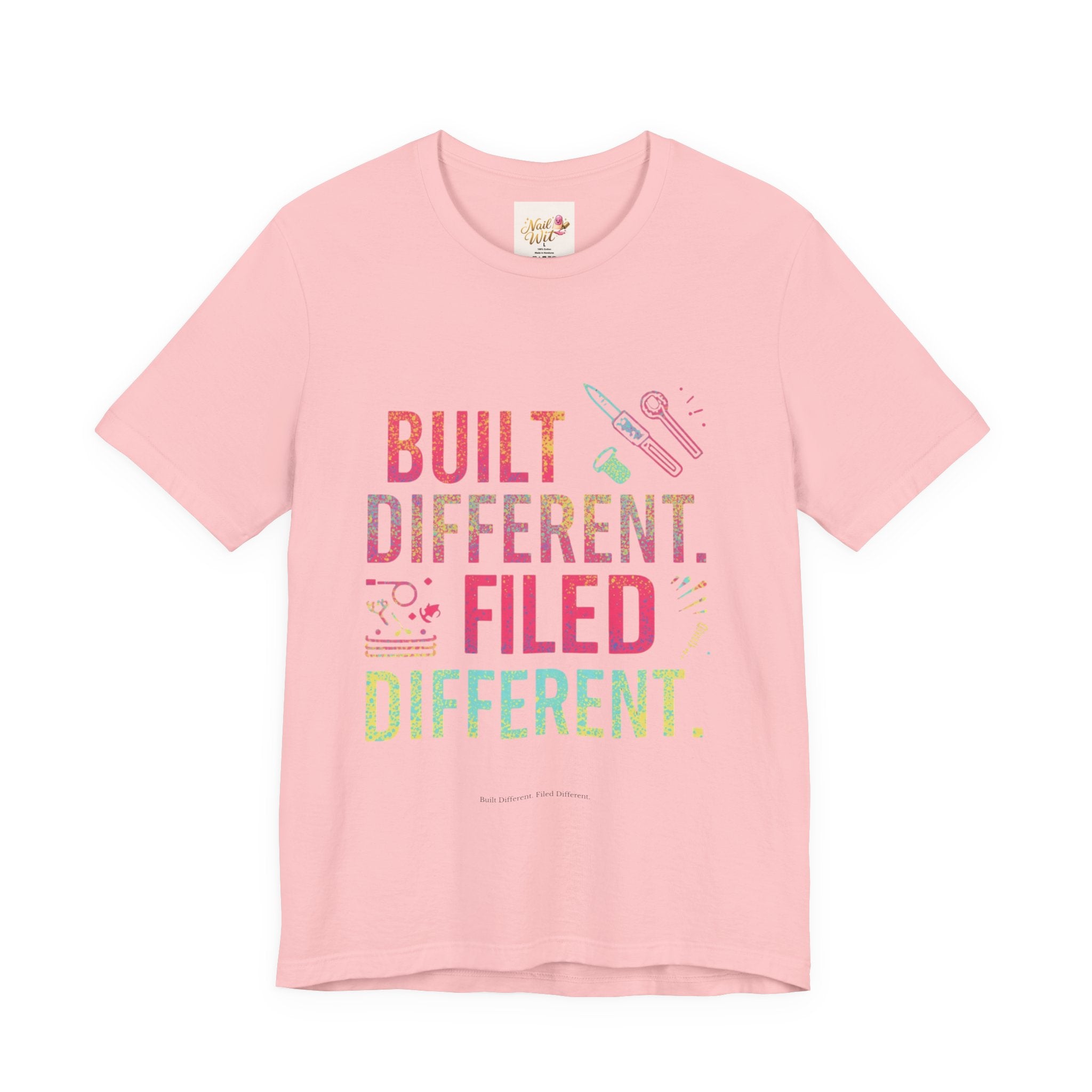 Pink t-shirt with colorful text and graphics on a white background