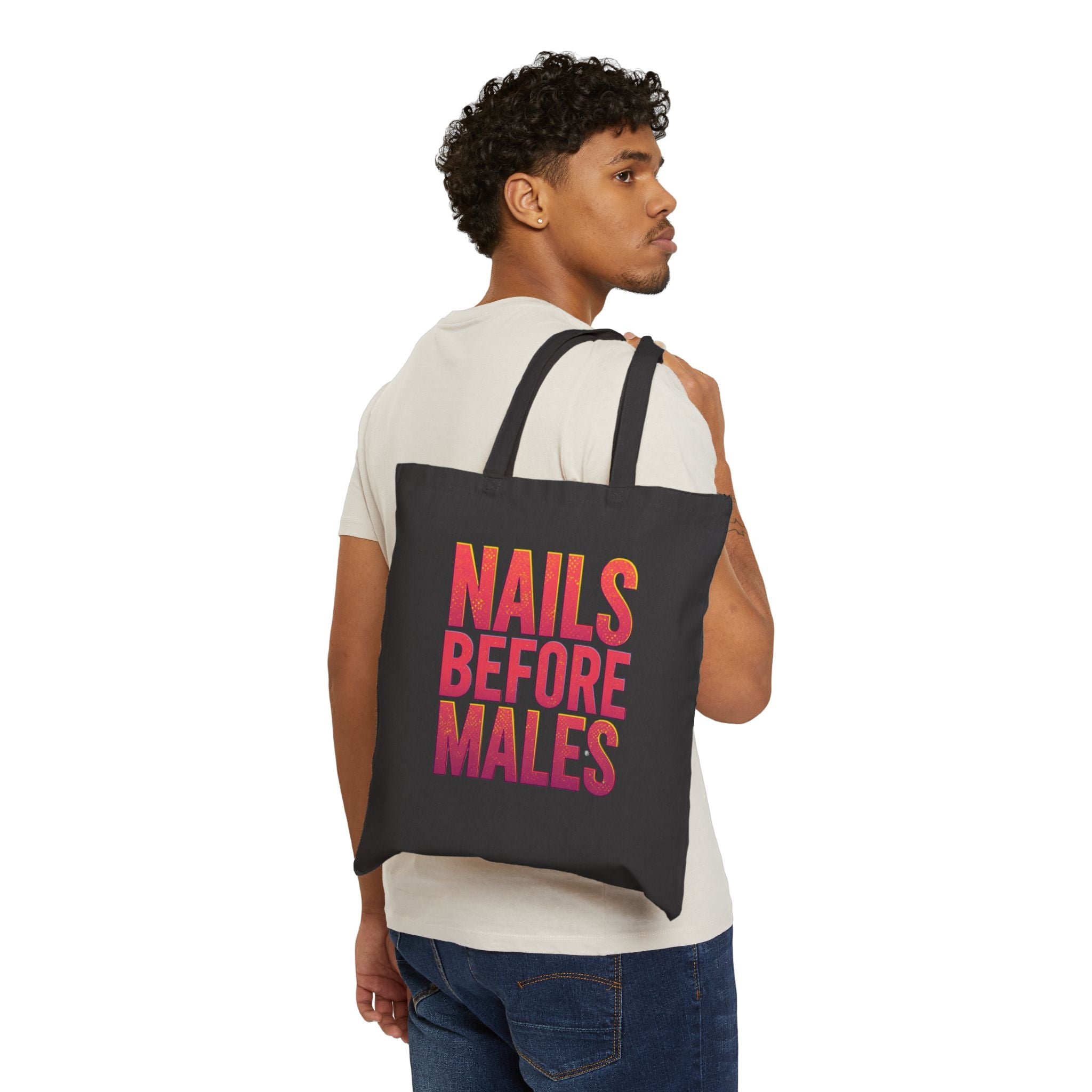 Person wearing a black tote bag with a heart design on a white background