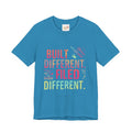 Blue t-shirt with colorful text and graphics on a white background
