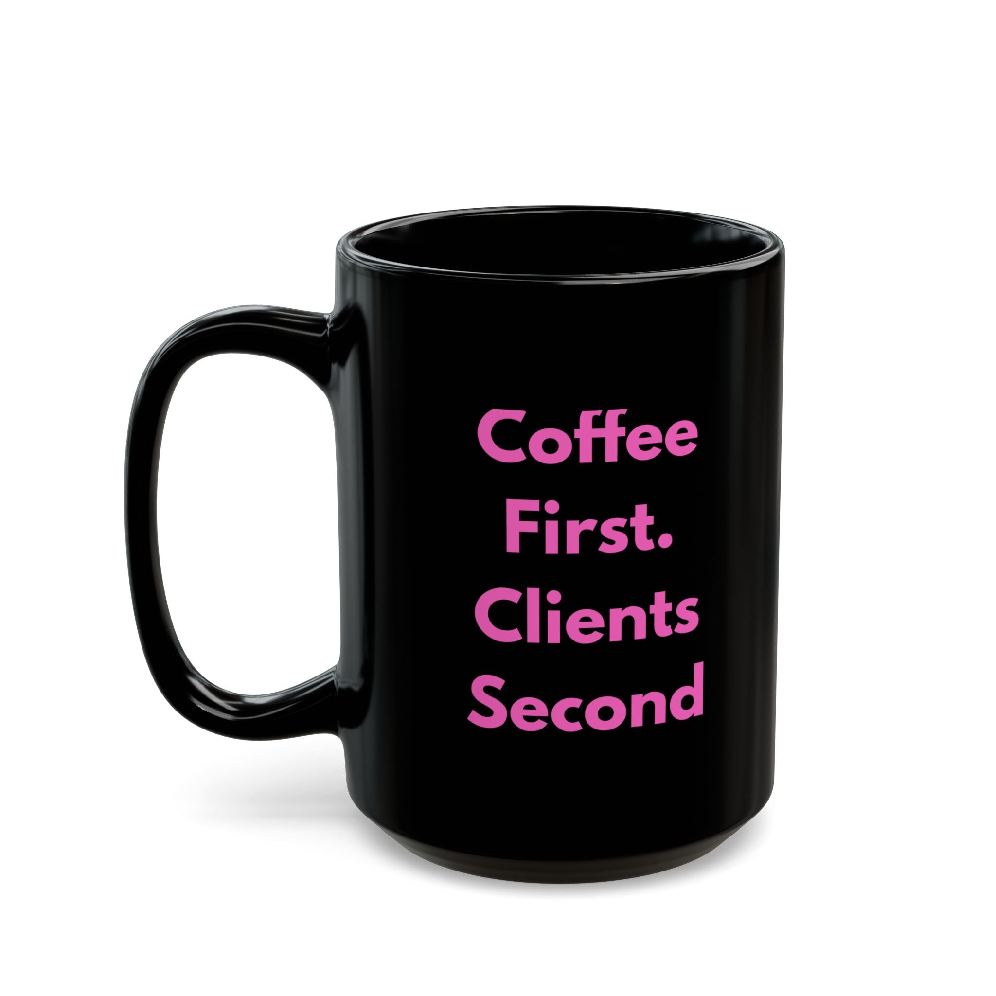 Black mug with pink text 'Coffee First. Clients Second' on a white background
