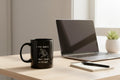 Black mug with white text and graphic on a white background