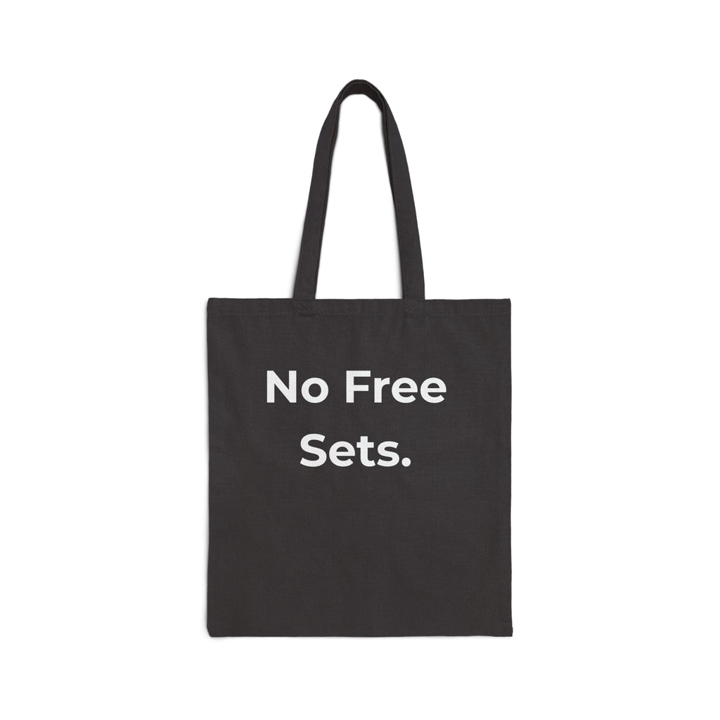 Black tote bag with 'No Free Sets.' text on a white background