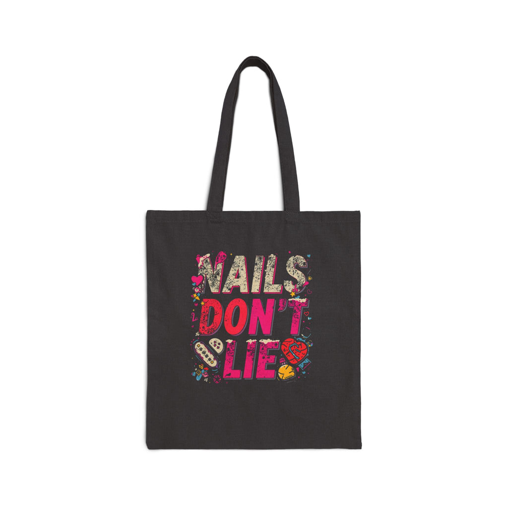 Black tote bag with colorful 'Nails Don't Lie' text design on a white background