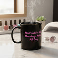 Black mug with white text on a white background