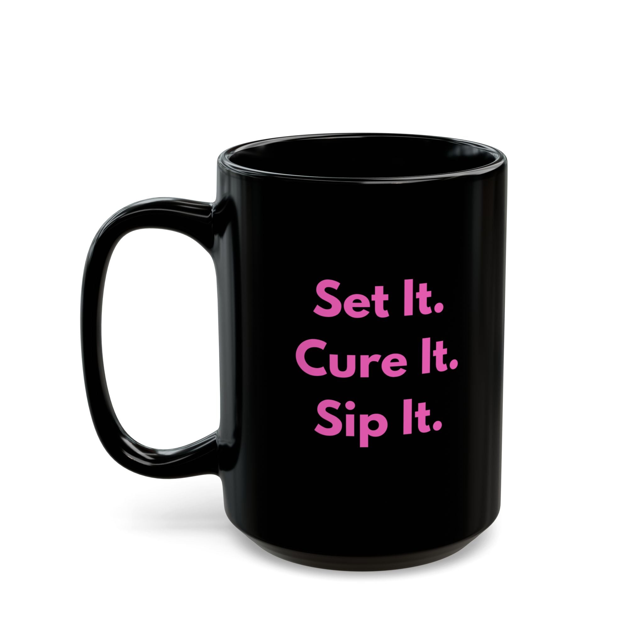 Black mug with pink text 'Book, Buff, Boss.' on a white background