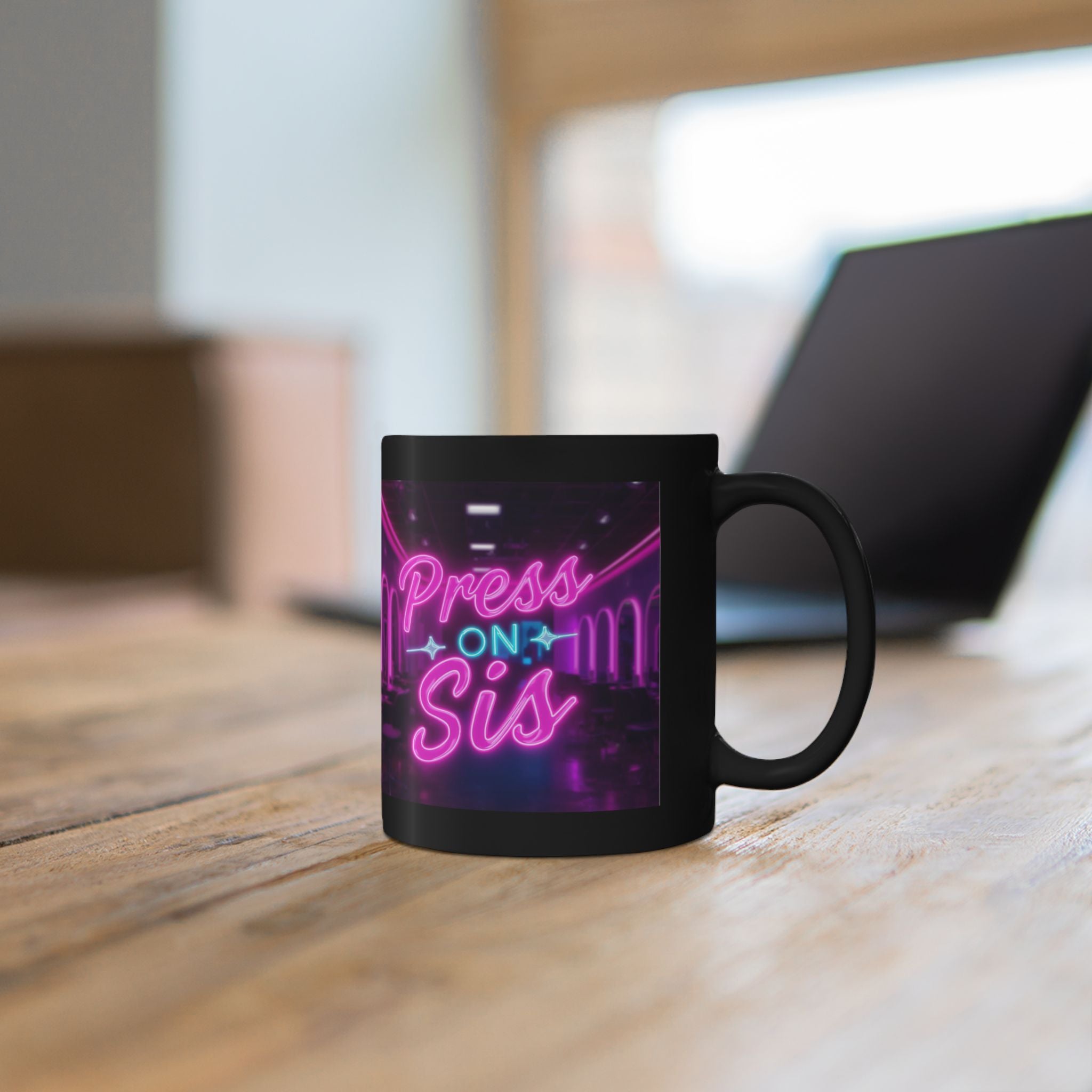 Black mug with 'Press On Sis' neon-style text on a wooden surface.